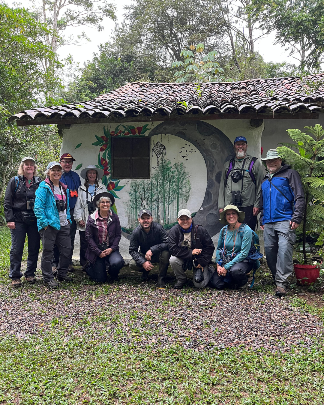 Birding group at eco-lodge with painted mural, Honduras